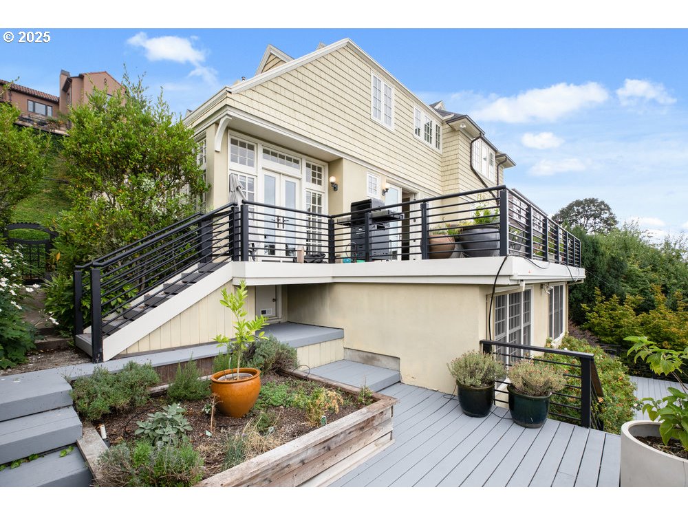 2677 Northwest Westover Road Portland, OR 97210 - Photo 43 of 48 a view of house with backyard outdoor seating and hardwood