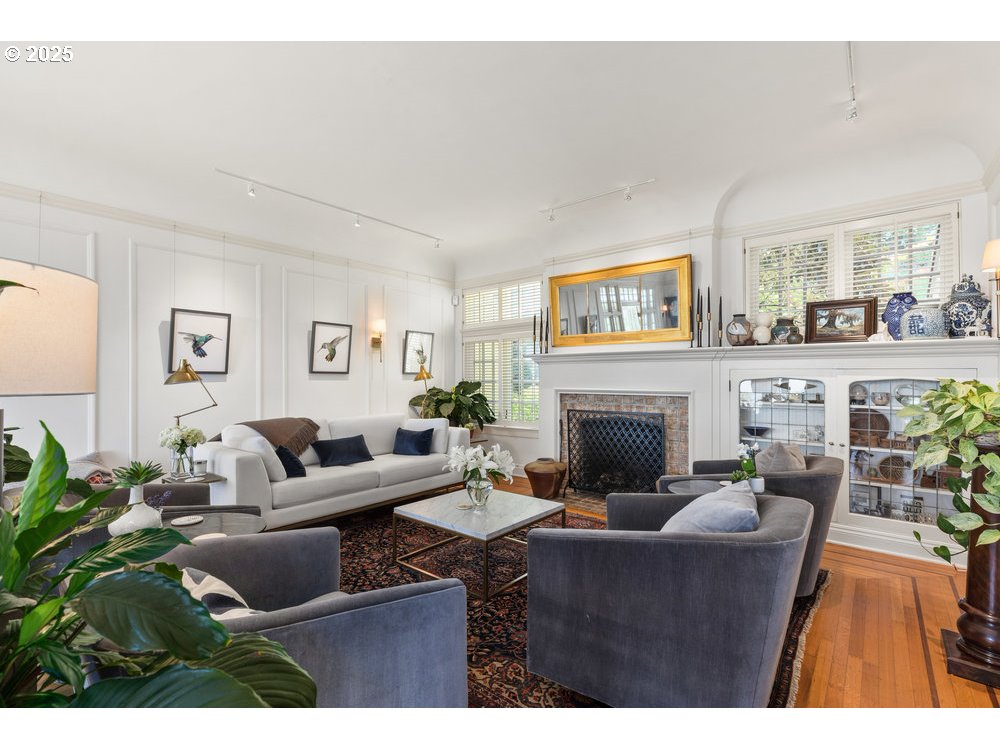 2677 Northwest Westover Road Portland, OR 97210 - Photo 8 of 48 a living room with furniture a fireplace and a table