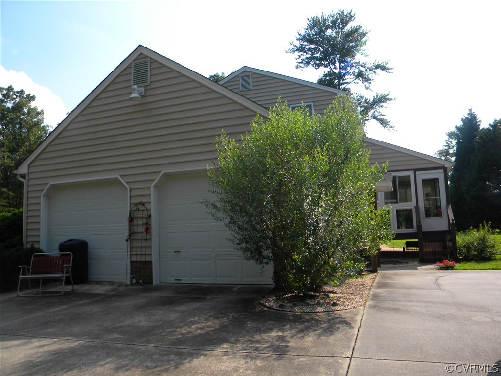 9410 Cosby Mill Road Quinton, VA 23141 - Photo 4 of 29 a house that has a tree in front of it