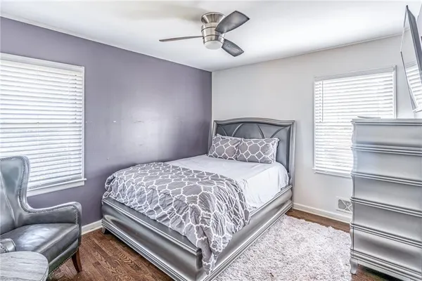 a bedroom with a bed and a chair