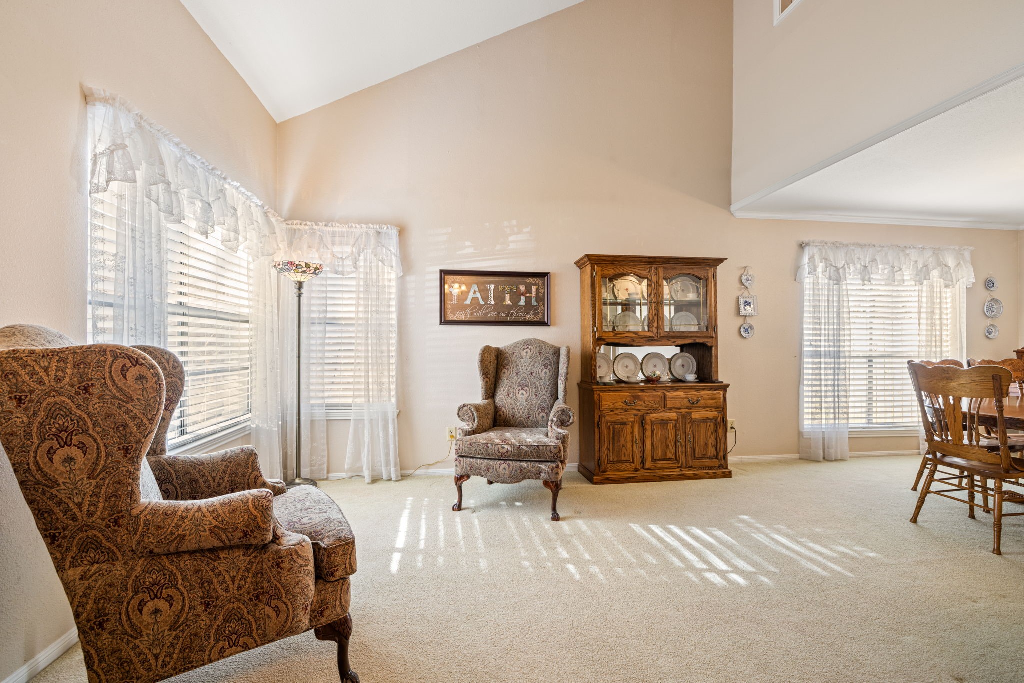 9102 Woodhouse Drive Spring, TX 77379 - Photo 5 of 32 LIVING ROOM - This room has a tall ceiling, making it feel even more spacious. It adjoins the dining room, making it a great spot for entertaining.
