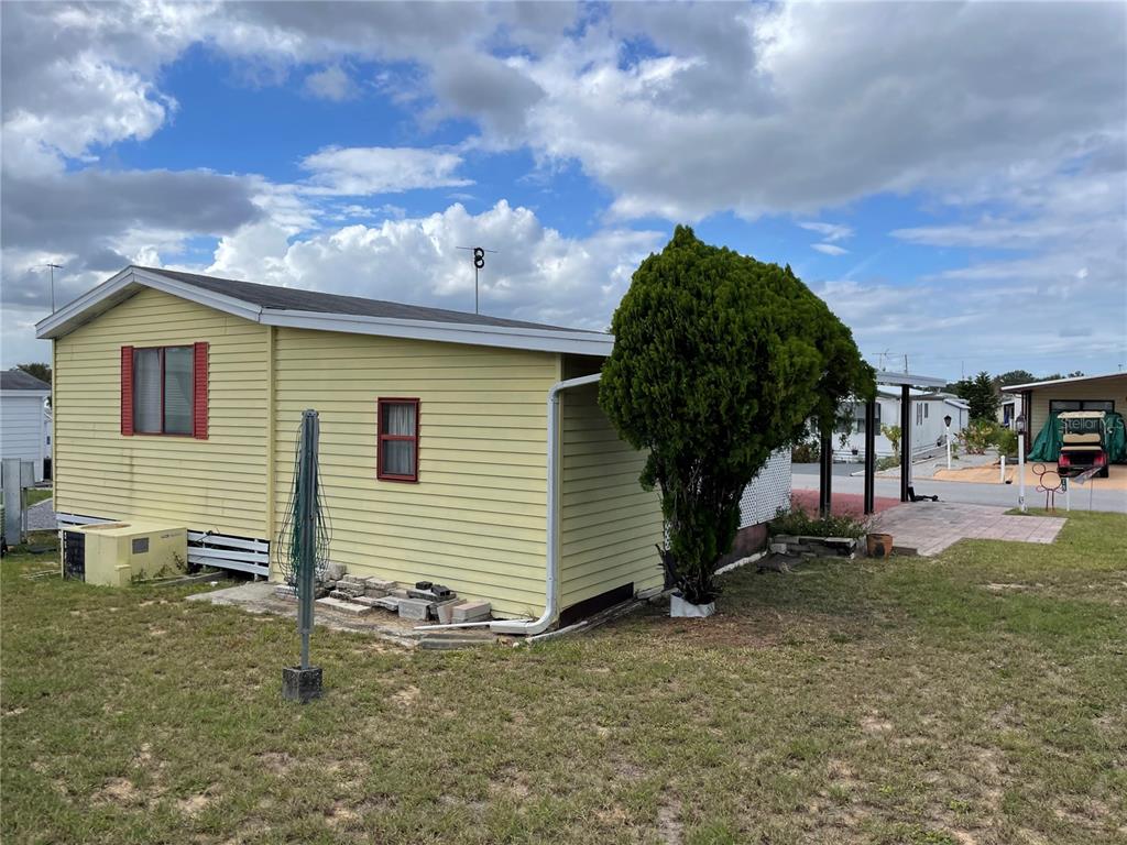 251 Patterson Road, Unit C25 Haines City, FL 33844 - Photo 4 of 10 a view of a house with a backyard