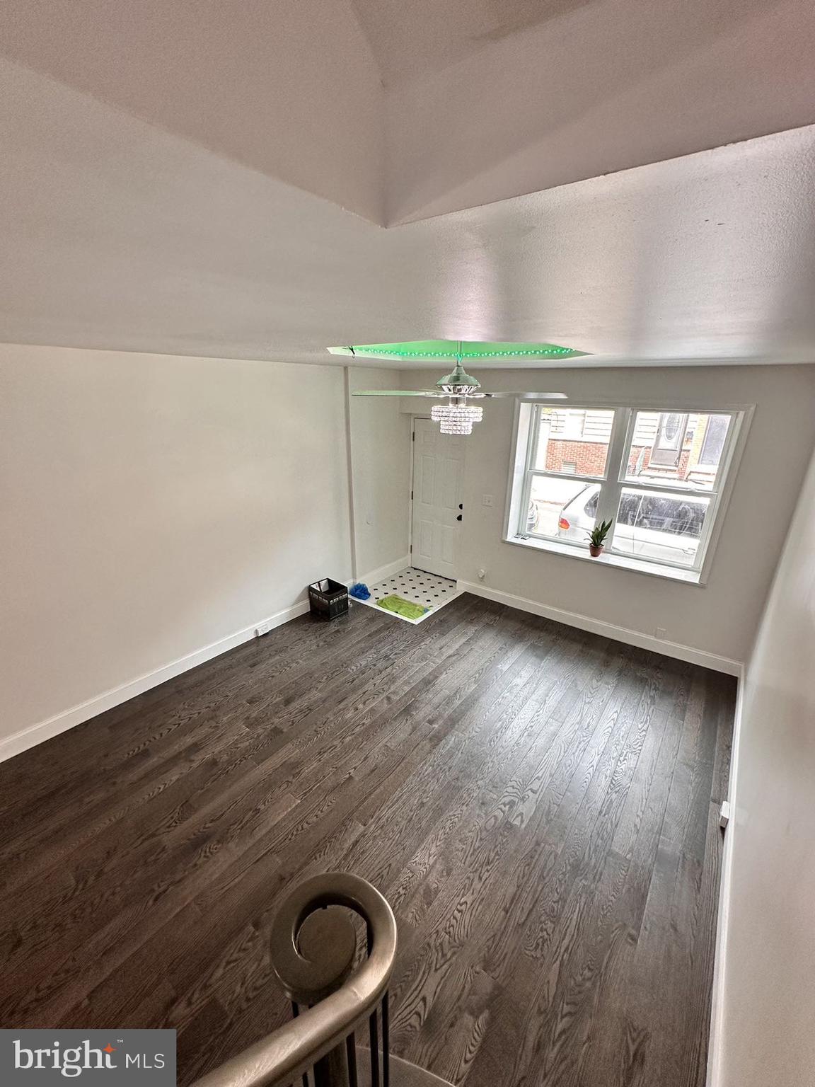 540 Manton Street Philadelphia, PA 19147 - Photo 13 of 25 an empty room with wooden floor and windows