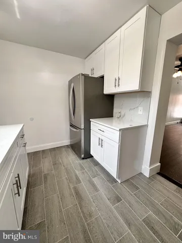 a utility room with cabinets washer and dryer