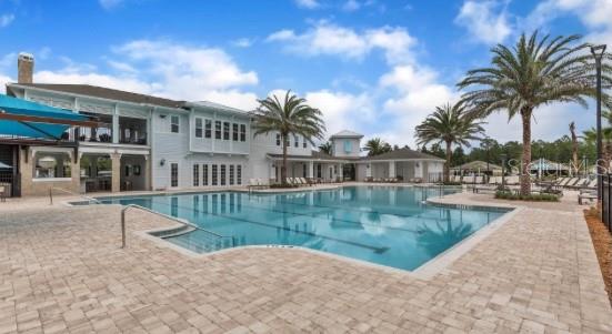 35 Birdie Way Bunnell, FL 32110 - Photo 52 of 57 a view of a swimming pool with a garden