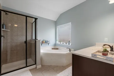 a bathroom with a sink a mirror and a bathtub