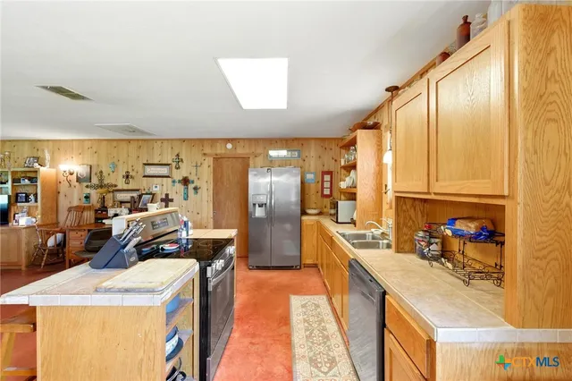a bed room with a bed window and dresser
