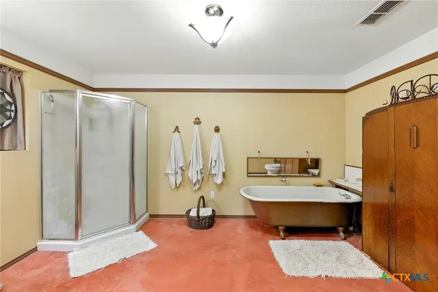 a bed room with a bed and a chandelier