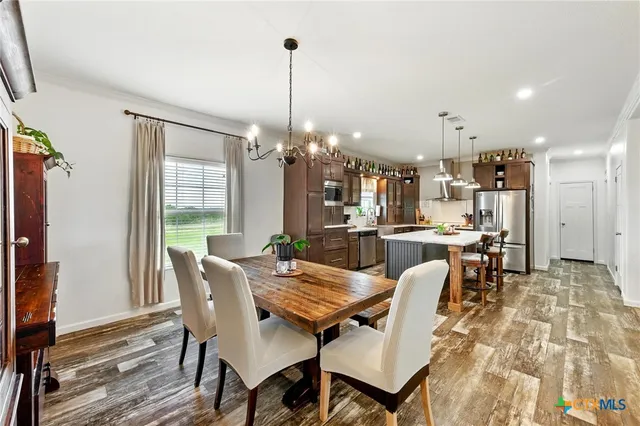 a large kitchen with granite countertop lots of counter top space