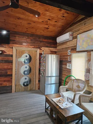 a living room with a table and chairs