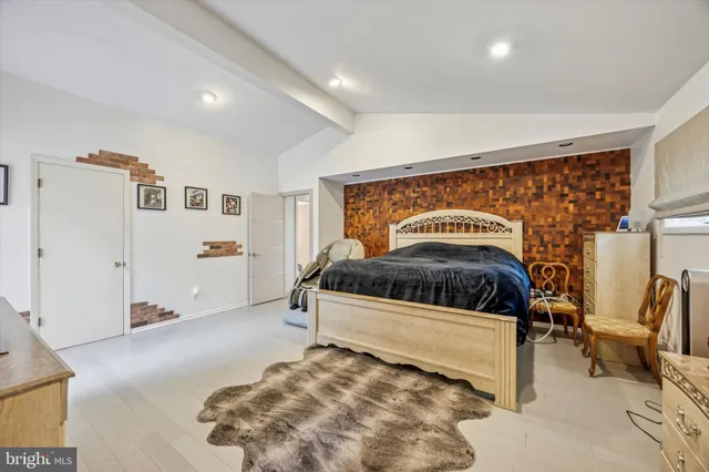 a bathroom with a bathtub sink and mirror