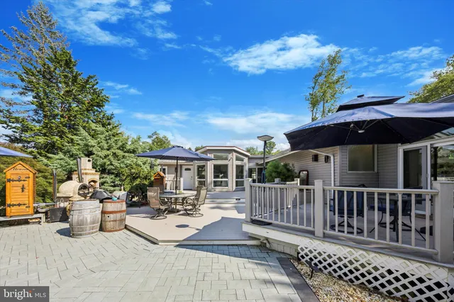a view of backyard with sitting area