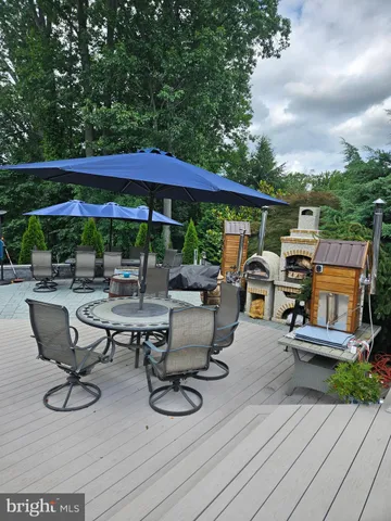 a pathway of a house with potted plants