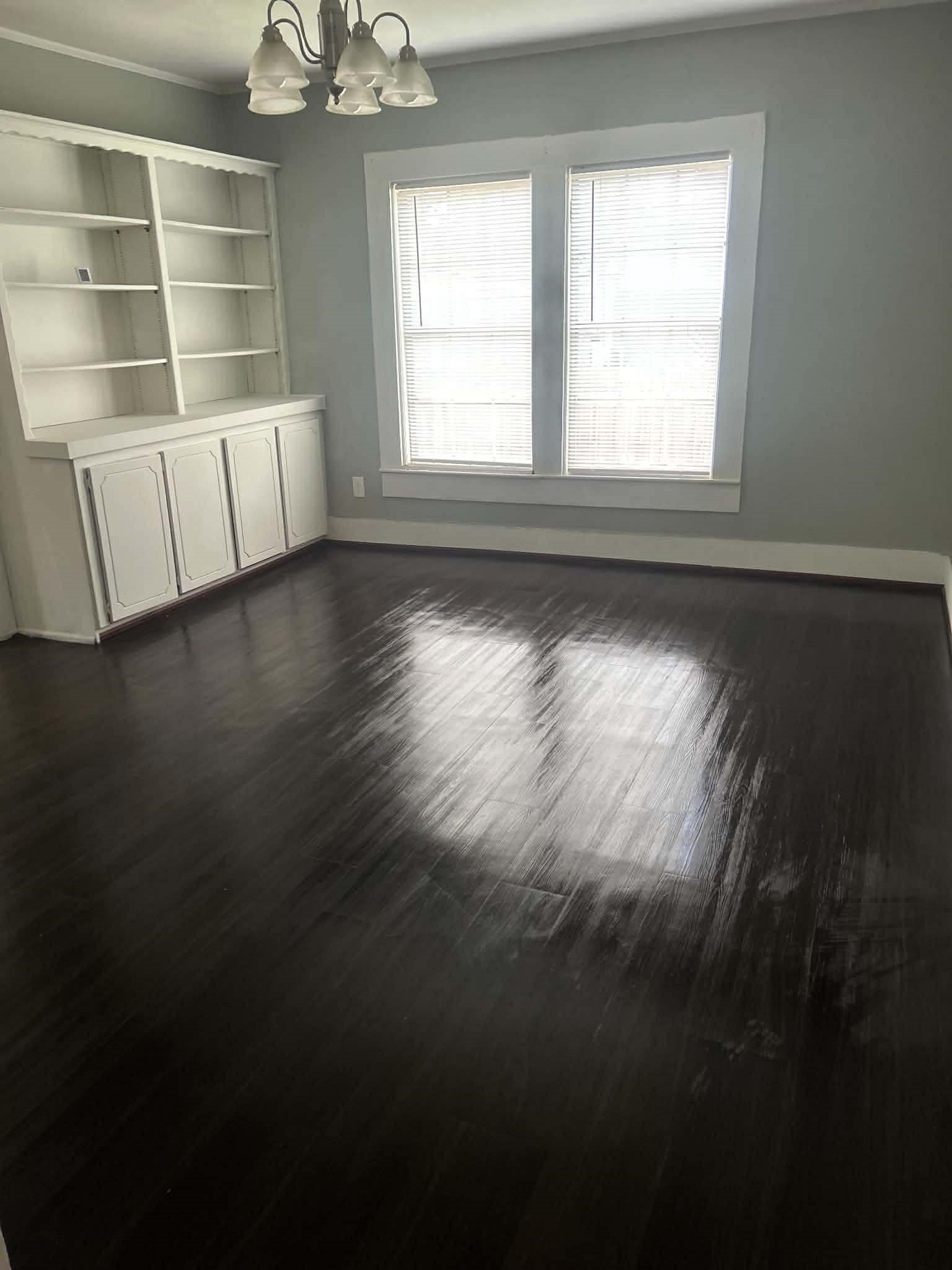 11 Smith Street Shepherd, TX 77371 - Photo 24 of 31 an empty room with wooden floor and windows