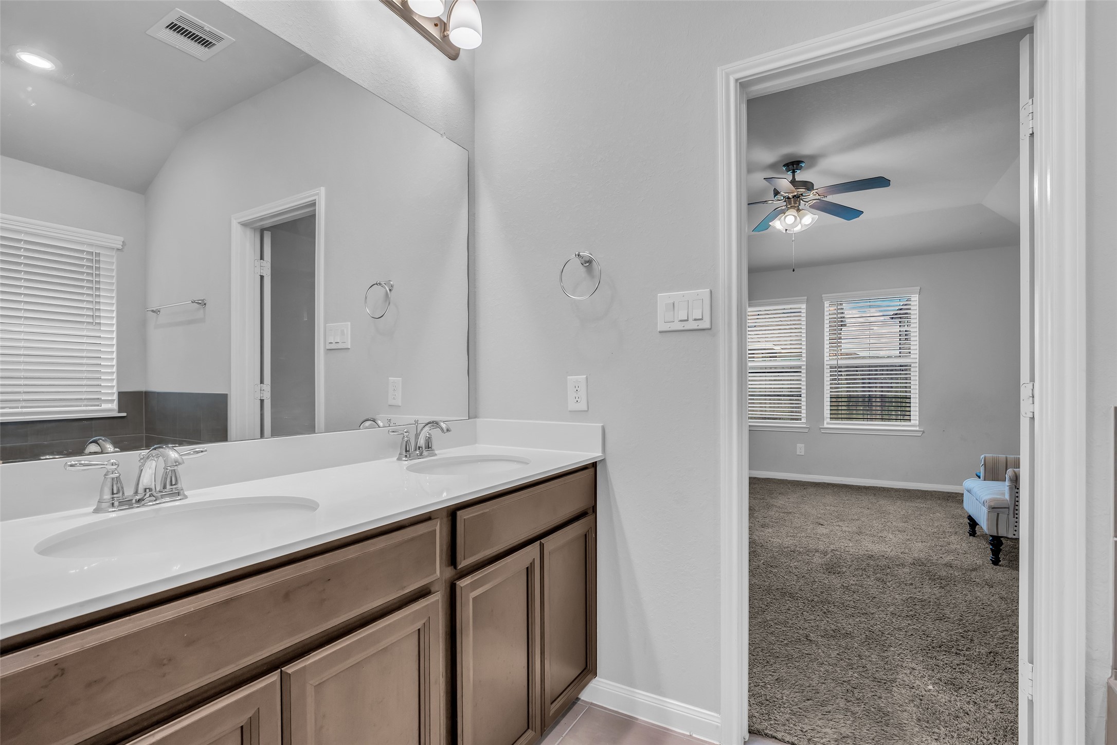 827 Cloverdale Drive Rosharon, TX 77583 - Photo 13 of 22 Primary ensuite with double sink vanity and an abundance of under sink storage.