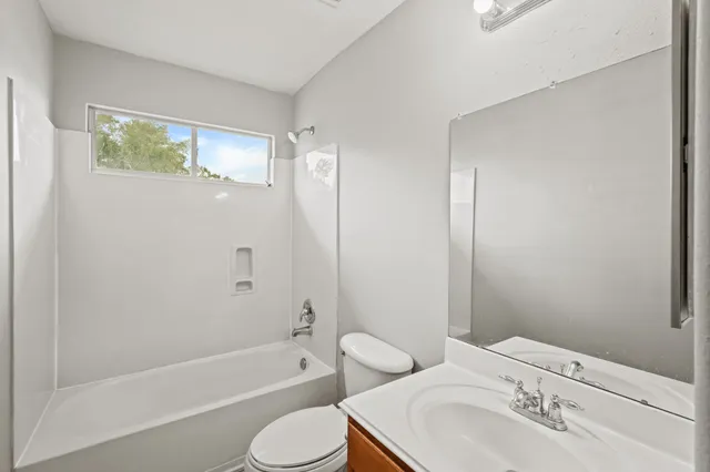 a bathroom with a toilet sink and bathtub