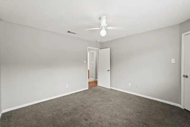 an empty room with a bathroom