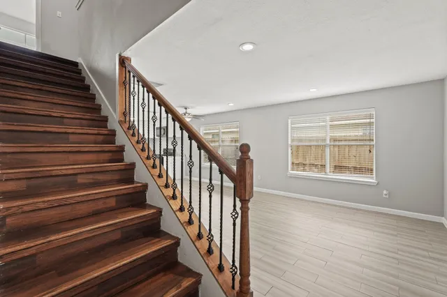 a view of an entryway with wooden floor