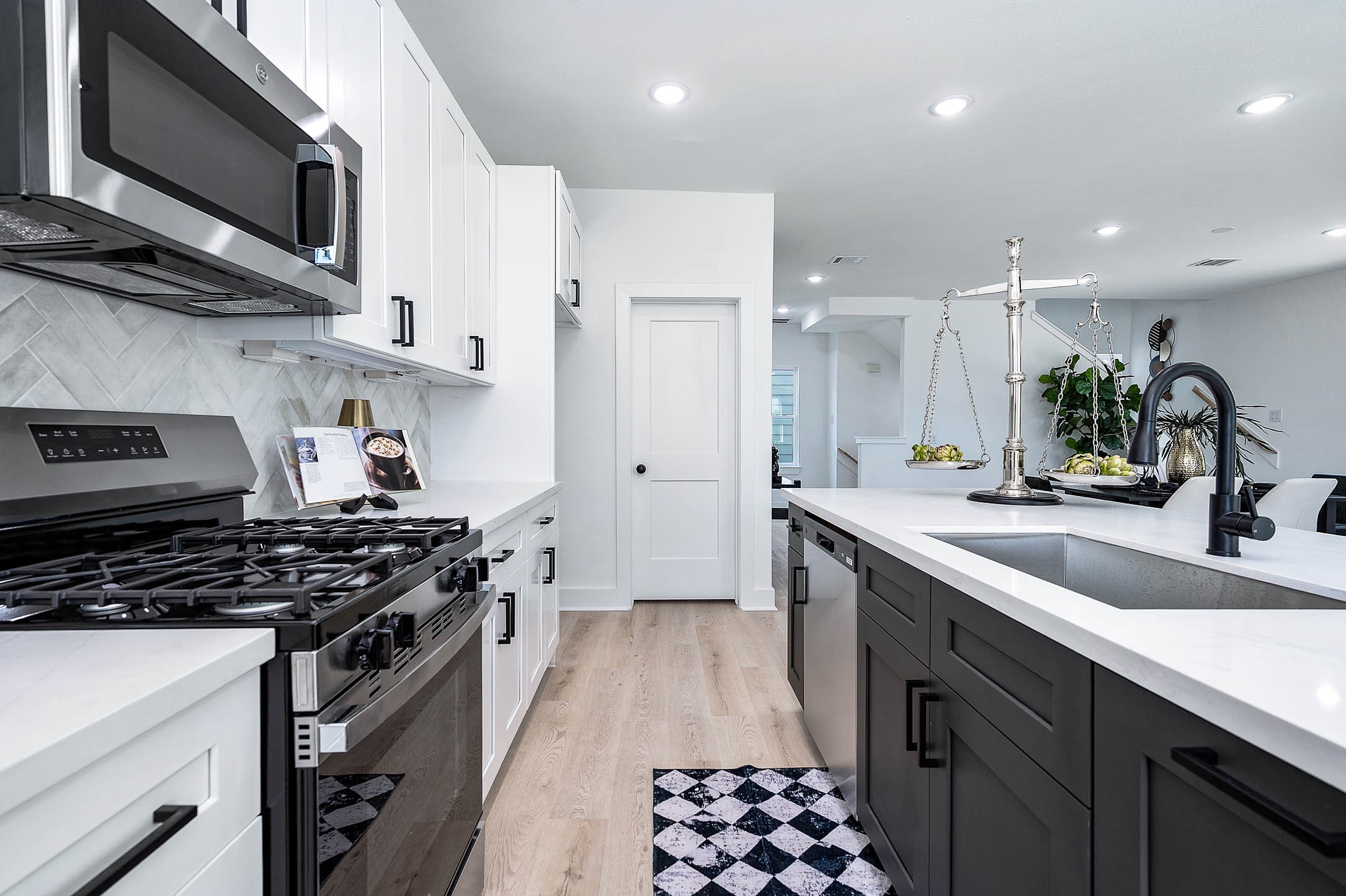 1515 Euel Street Houston, TX 77009 - Photo 17 of 34 Clean and modern cooking space with ample cabinetry, stainless steel appliances, and streamlined design.