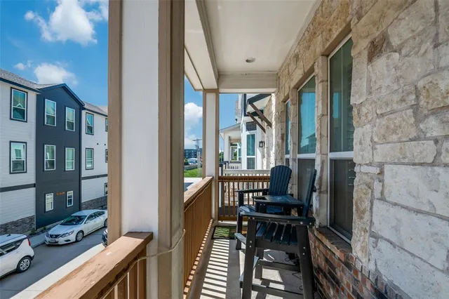 a view of a balcony with chairs