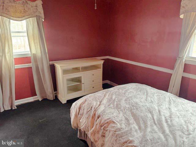 9285 Old Stagecoach Road La Plata, MD 20646 - Photo 12 of 14 a bedroom with a bed and a mirror