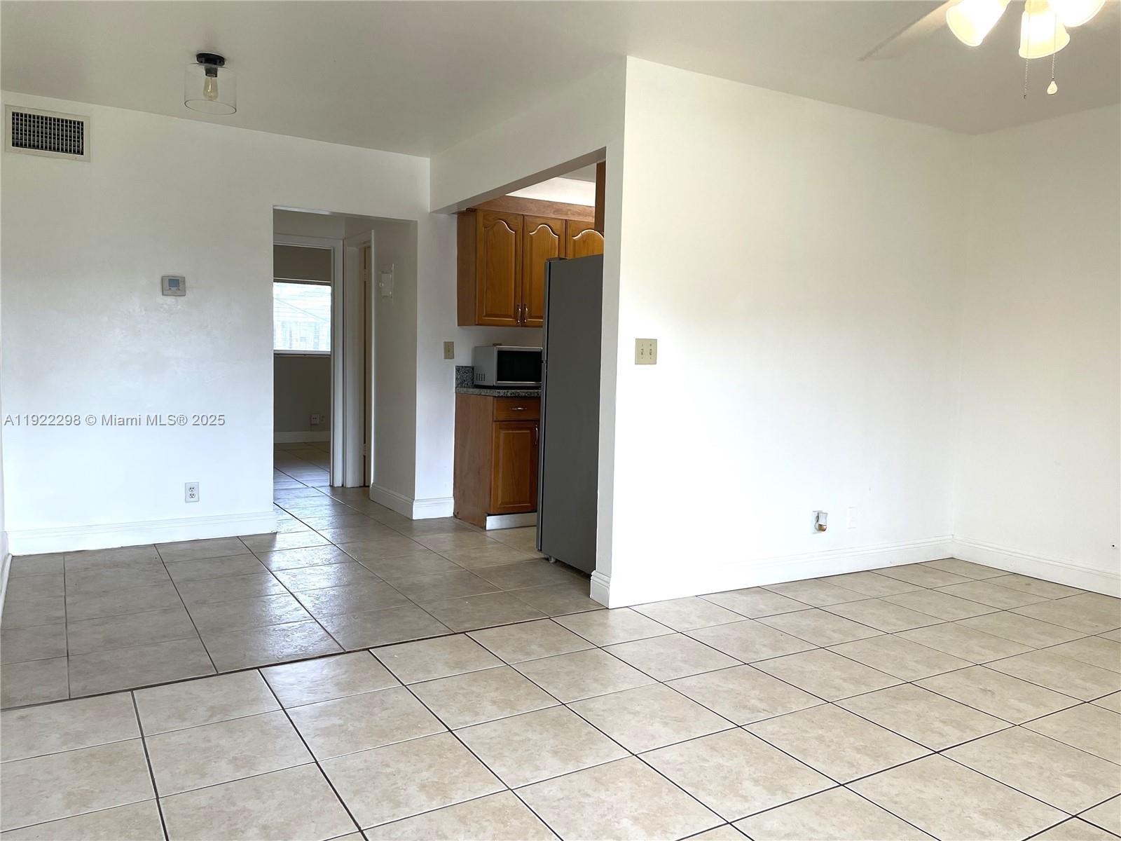 2121 Northeast 40th Court, Unit 2 Lighthouse Point, FL 33064 - Photo 2 of 11 a view of a room with a utility room