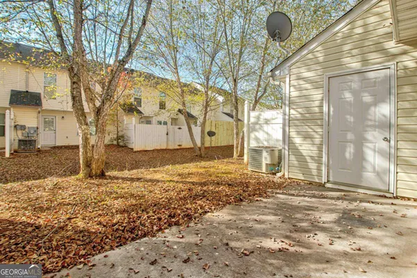 a view of a backyard of the house