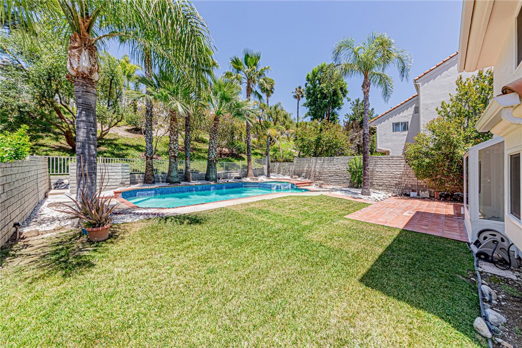 25533 Longfellow Place Stevenson Ranch, CA 91381 - Photo 33 of 47 a view of a backyard with a garden