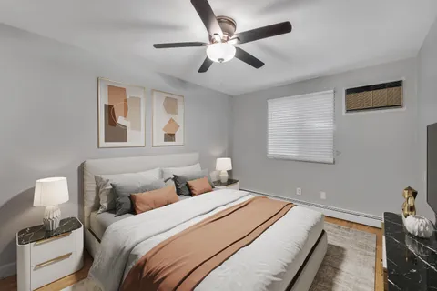 a bedroom with a bed and a window