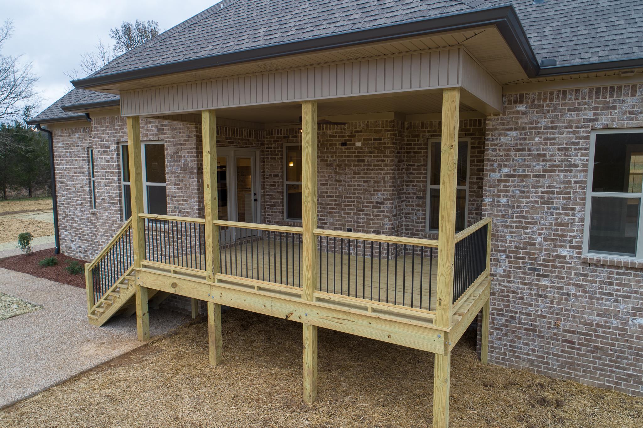 1720 Dillon Road Milton, TN 37118 - Photo 3 of 30 a wooden bench sitting in front of a building