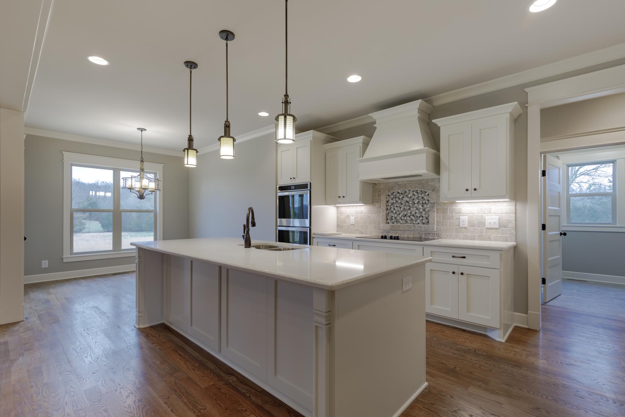1720 Dillon Road Milton, TN 37118 - Photo 8 of 30 a large kitchen with stainless steel appliances a large center island wooden floor and a large window