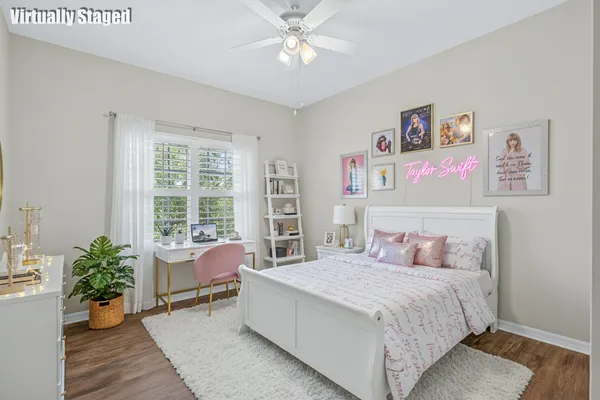 a bedroom with a large bed and potted plant