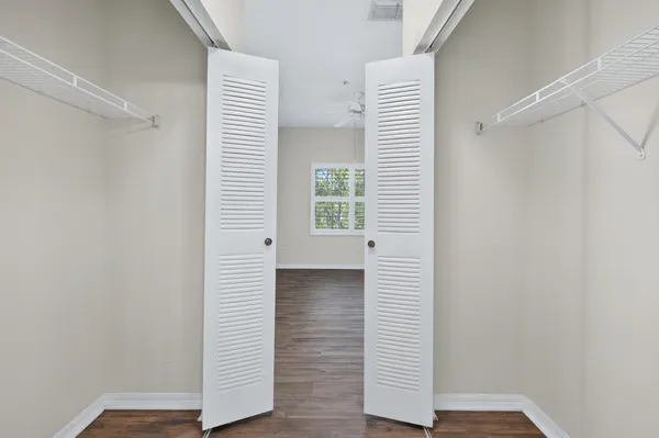 a view of a small space & a window in a room