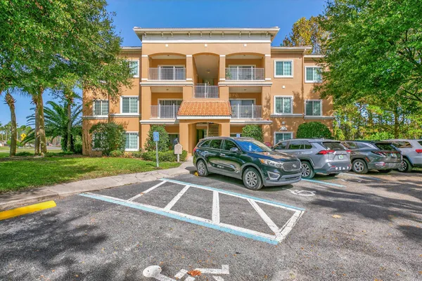 a view of a cars parked in front of a house