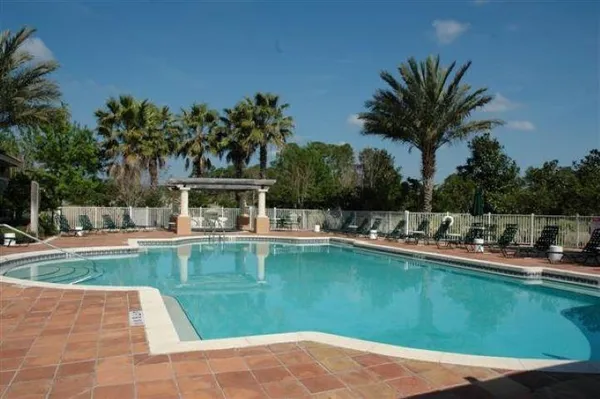 a view of a swimming pool with a lounge chair