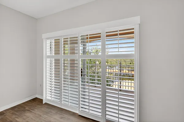 a view of a room that has a large window