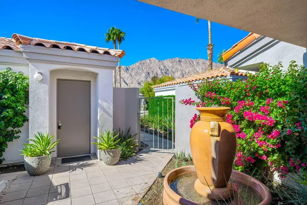 a view of a entryway with flower pots