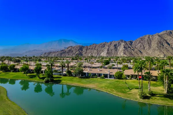 a view of a town with mountains in the background