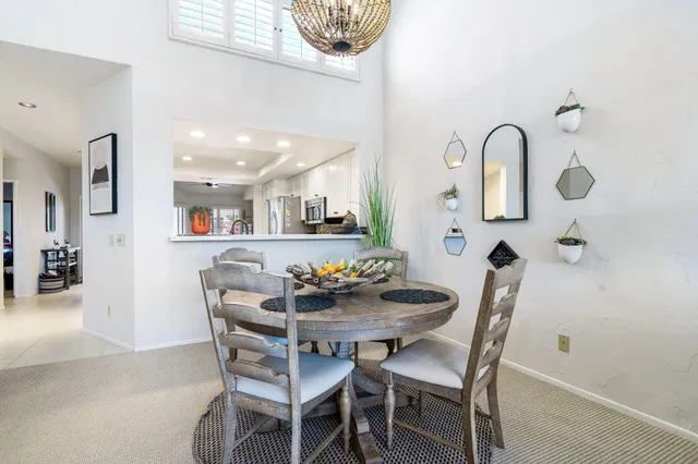 a dining room with furniture and window