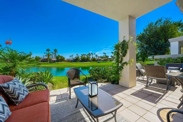 a view of a chairs and table in patio