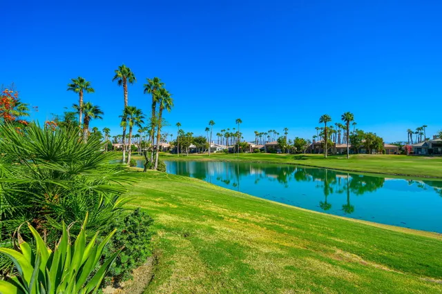 a view of a lake with a house in the background