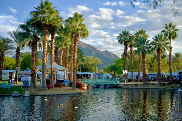 a view of a patio with a table and chairs under an umbrella