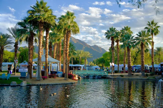 a view of a patio with a table and chairs under an umbrella