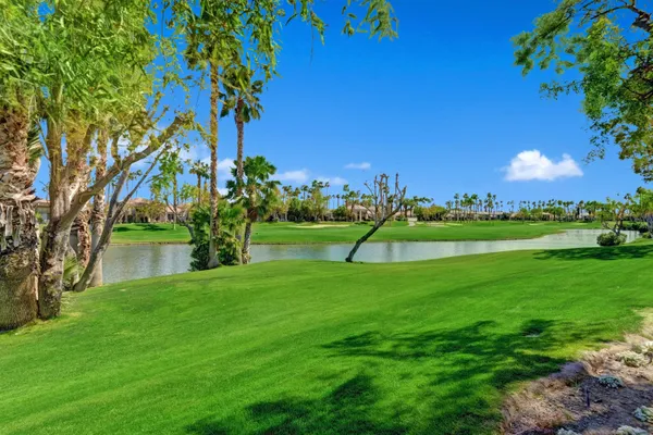 a view of a golf course with a lake