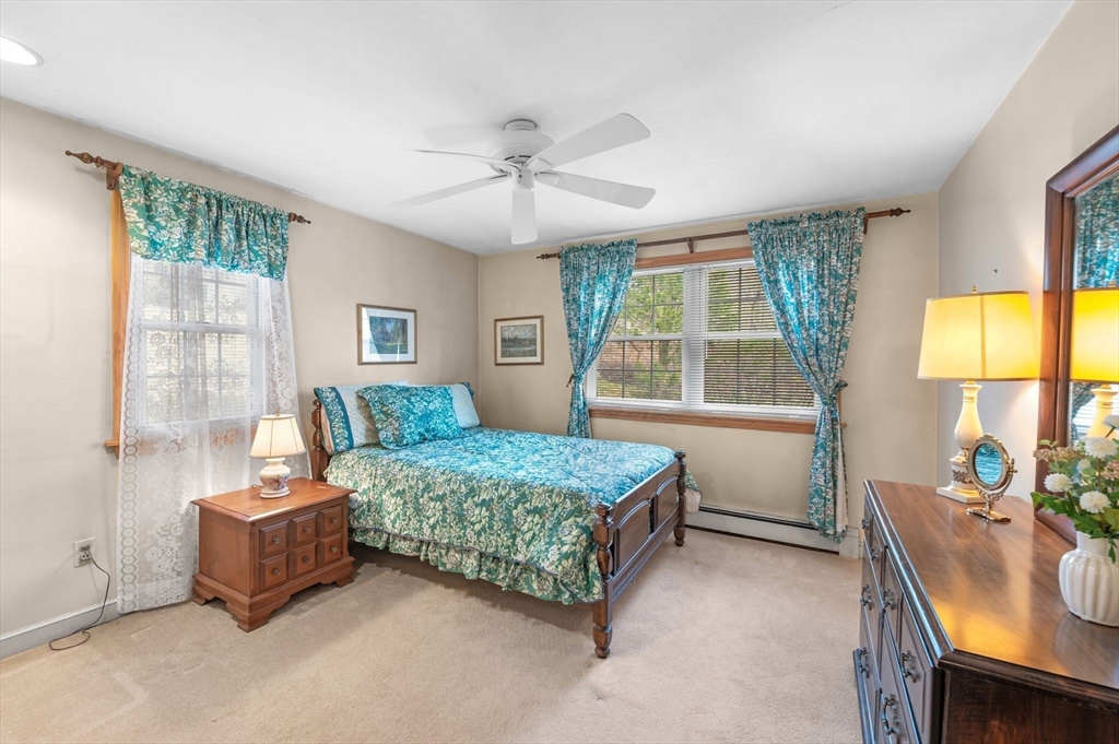 68 Preston Street, Unit 9D Wakefield, MA 01880 - Photo 13 of 29 a bedroom with a bed and a window