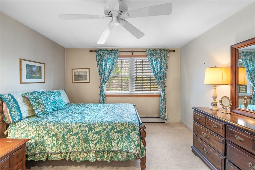 68 Preston Street, Unit 9D Wakefield, MA 01880 - Photo 14 of 29 a bedroom with a large bed and a window