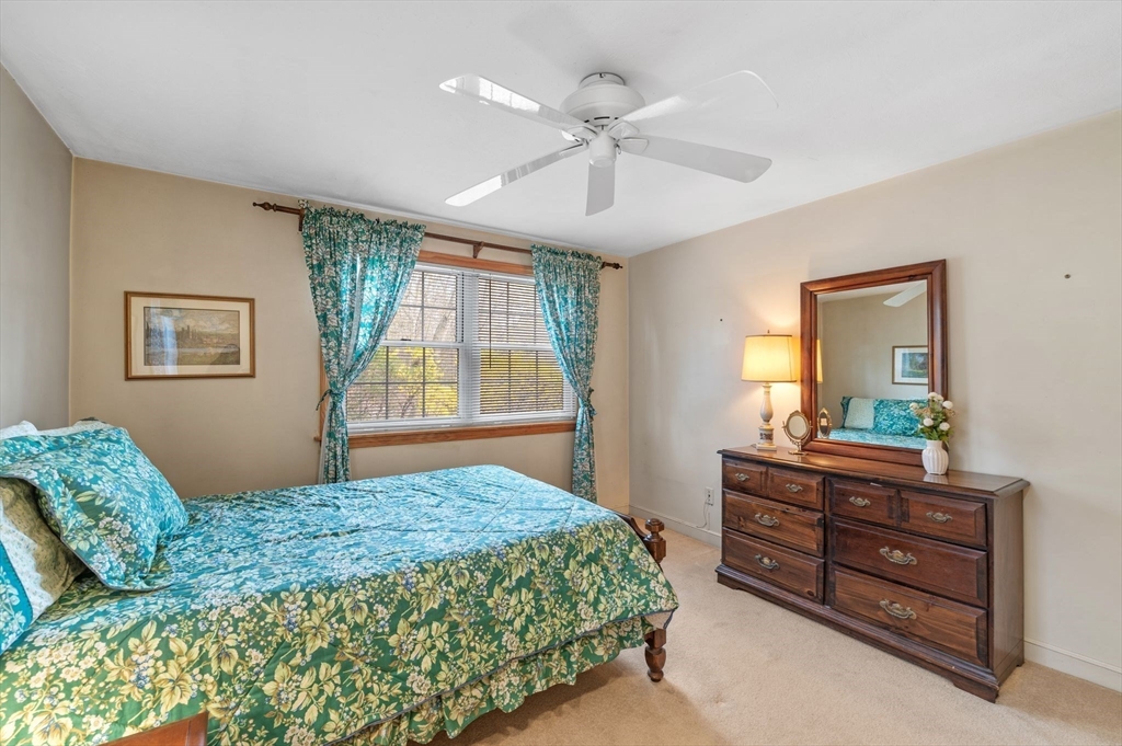 68 Preston Street, Unit 9D Wakefield, MA 01880 - Photo 15 of 29 a bedroom with a bed and a dresser