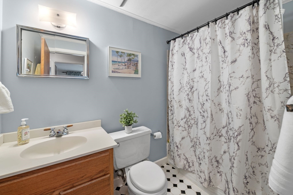 68 Preston Street, Unit 9D Wakefield, MA 01880 - Photo 20 of 29 a bathroom with a sink toilet and a mirror