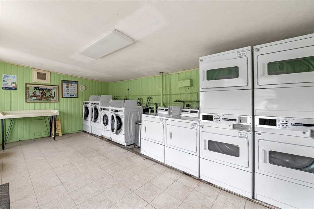 68 Preston Street, Unit 9D Wakefield, MA 01880 - Photo 23 of 29 a utility room with multiple dryer and washer