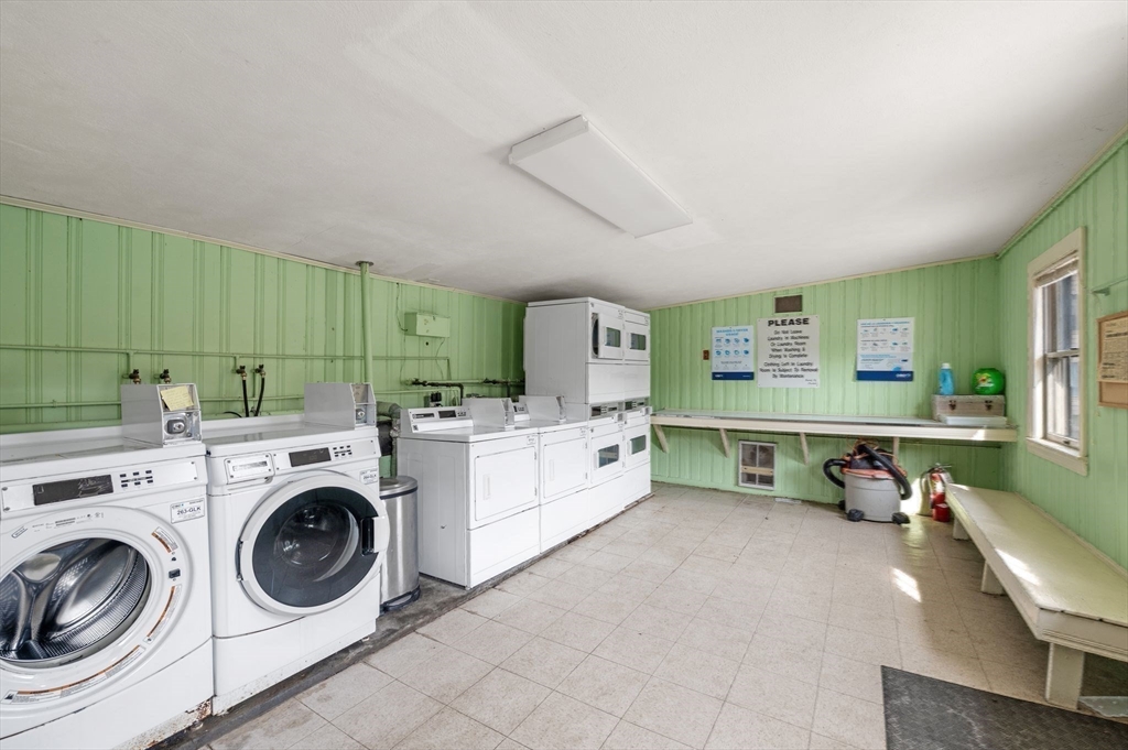 68 Preston Street, Unit 9D Wakefield, MA 01880 - Photo 24 of 29 a utility room with dryer washer and a view of living room